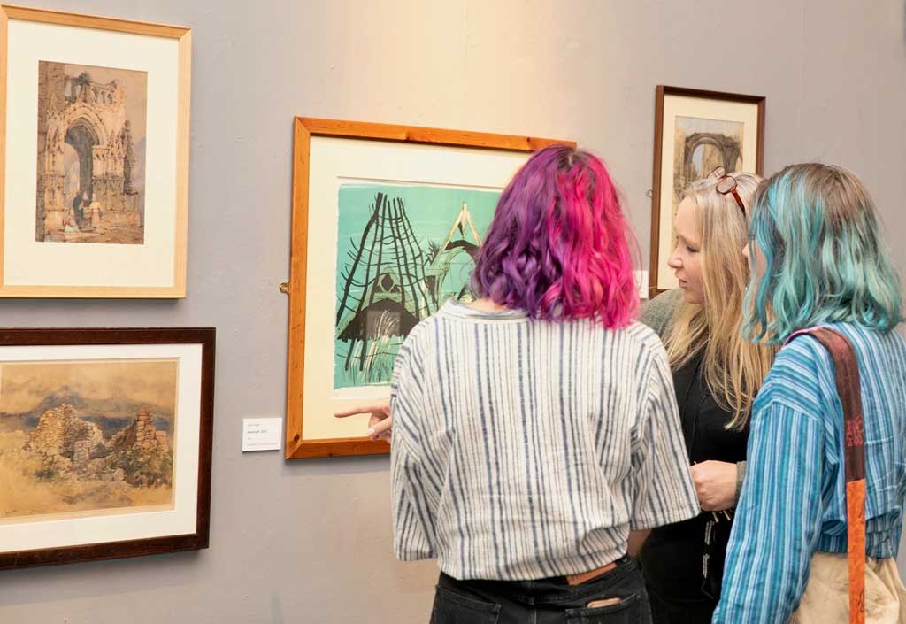 Curator giving tour of Living Ruins exhibition at Worcester City Art Gallery