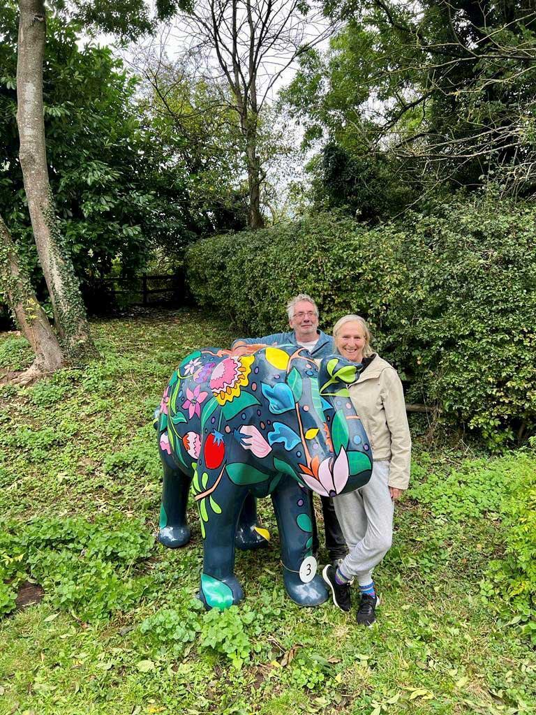 Photo of people with model elephant