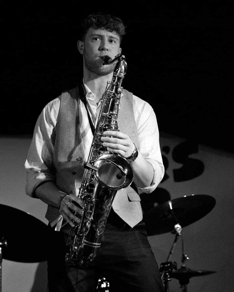 Photo of sax player from the band Year of the Dog