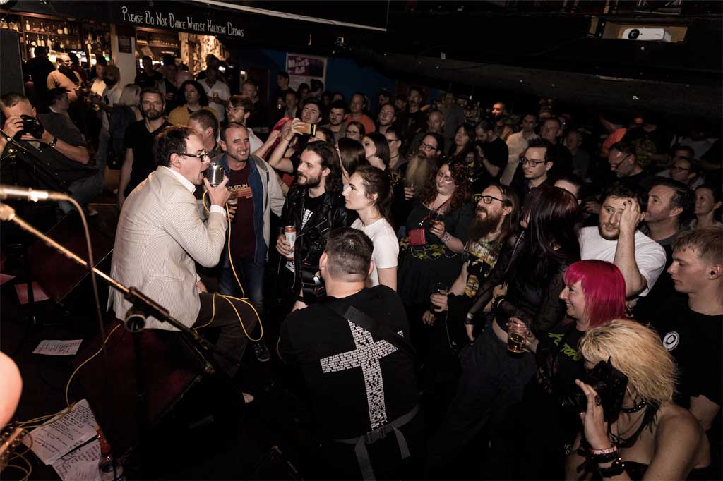 Photo of band and audience at Hey You Guys gig
