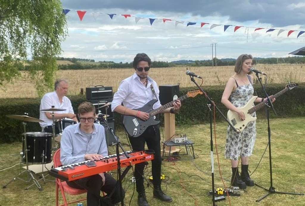 Photo of band Icy Moon Explorers performing in a field
