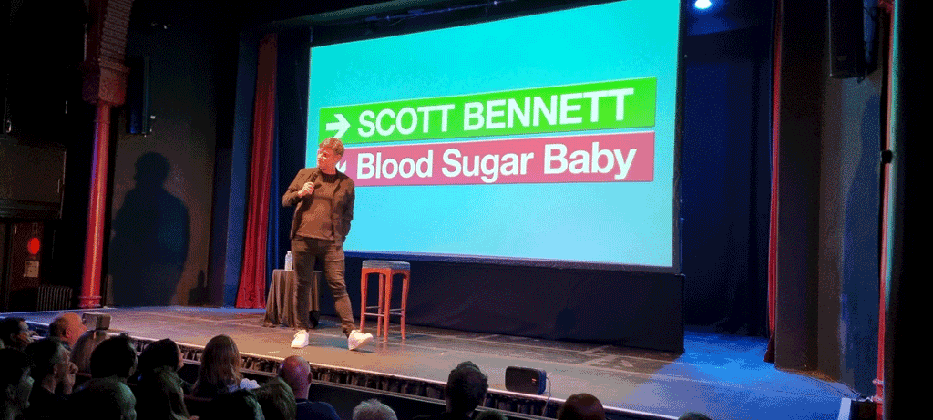 Photo of Scott Bennett on stage