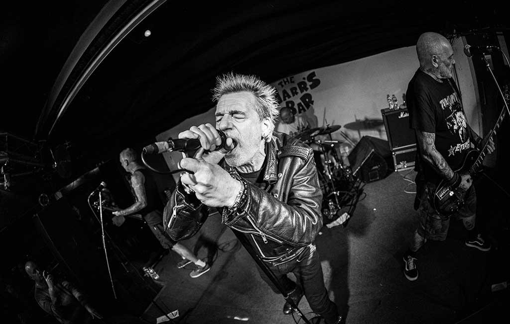 Photo of band GBH on stage