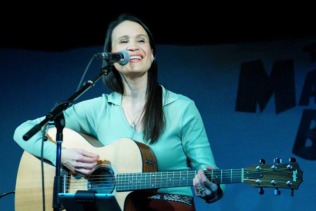 Photo of Amy Eftekhari on stage