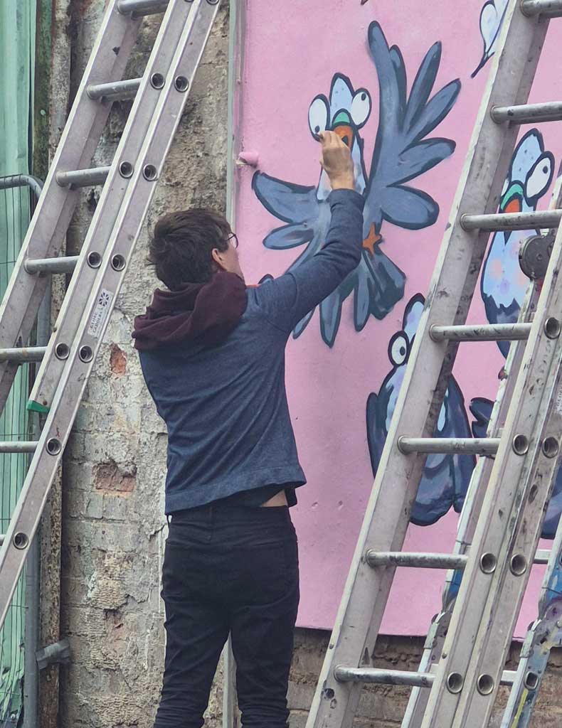 Photo of people painting mural