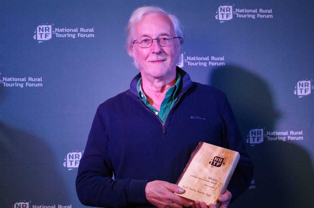 Photo of John Laidlaw with his NRTF lifetime achievement award