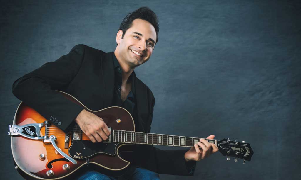 Photo of sunjay playing guitar