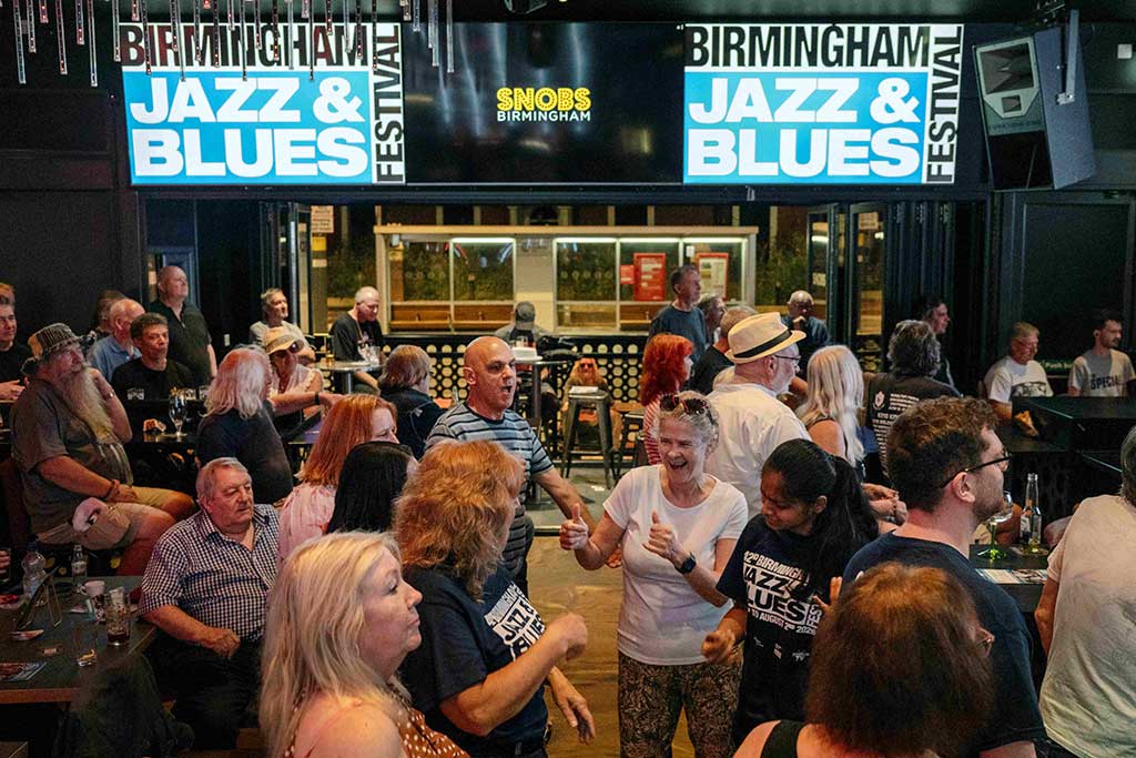 Photo of Audiences dancing to Dirt Road Band at Snobs