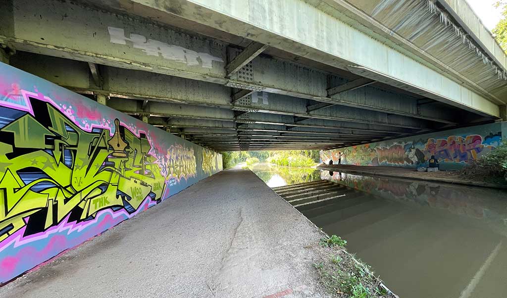 Photo of a Mural under a canal bridge