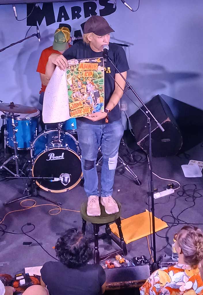 Photo of Jeffrey Lewis and his artwork