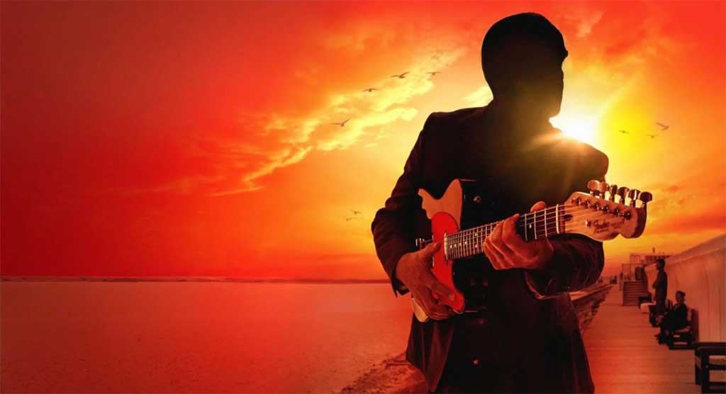 Photo of guitarist in Sunset