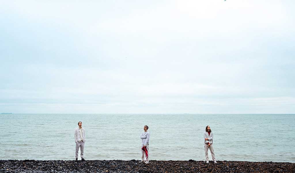 Photo of the band LotusBliss on a beach